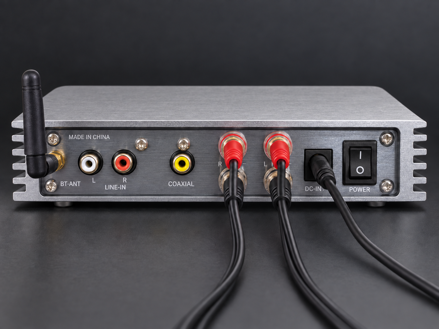 AMP03 rear connection illustration with Bluetooth antenna, four speaker leads and DC power connected; RCA and coaxial inputs unused.